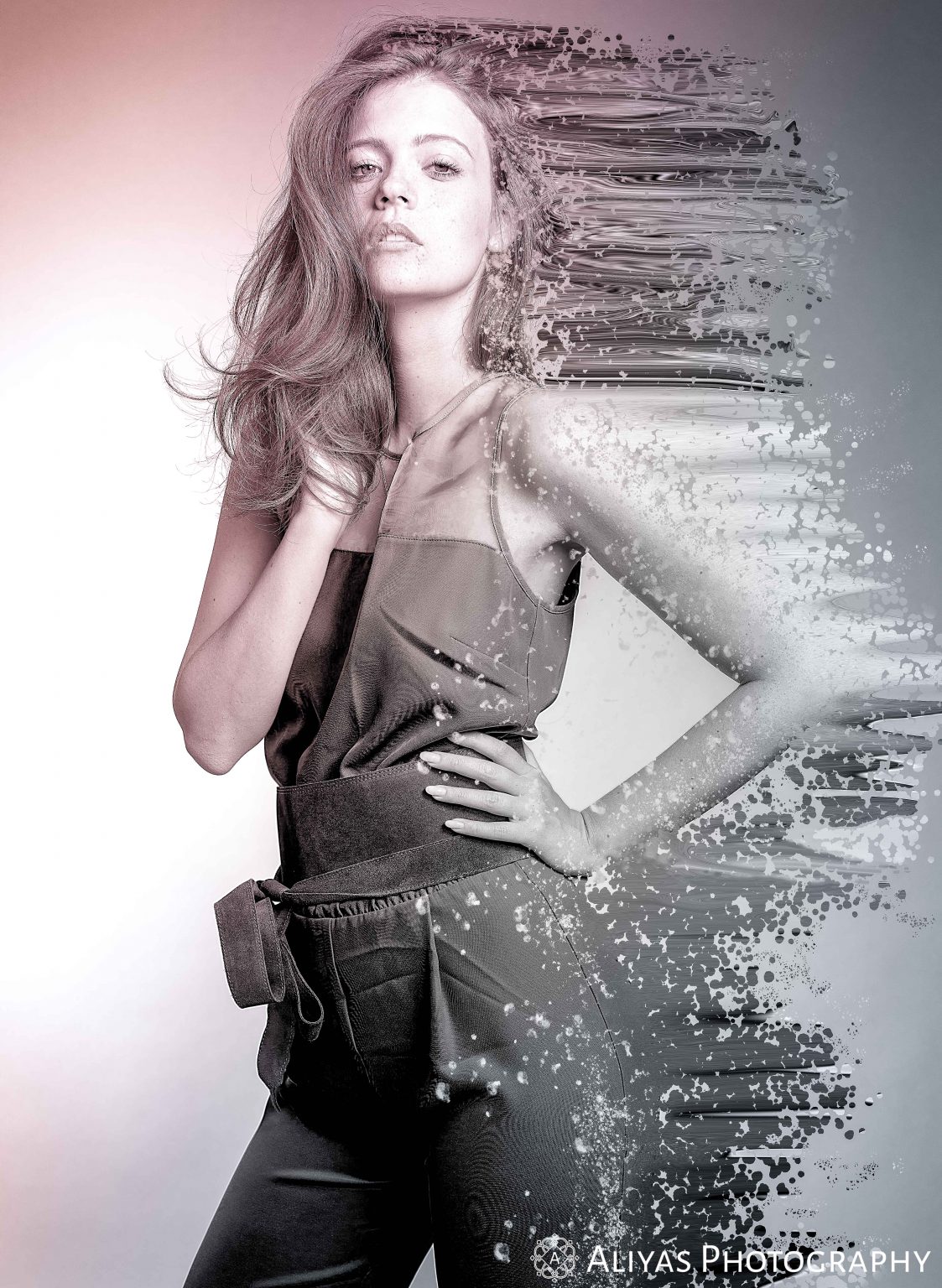 On the picture, you can see a model wearing a jumpsuit. The picture is special as it also contains a disintegration effect.